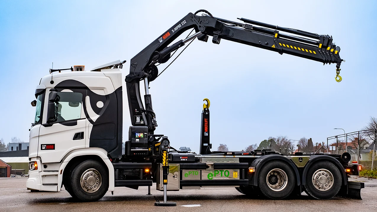 Loader crane unloading pallets from a truck in Aylesbury